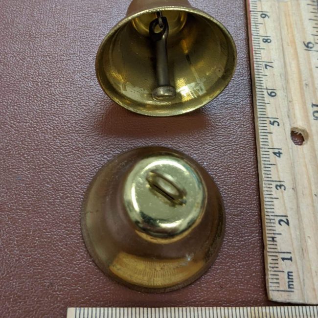 Image of a gold-colored bell-shaped jewelry finding, often used as a decorative element or end cap in jewelry making.