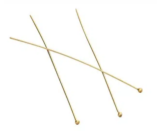 Three gold-plated ball head pins for jewelry making on a white background.